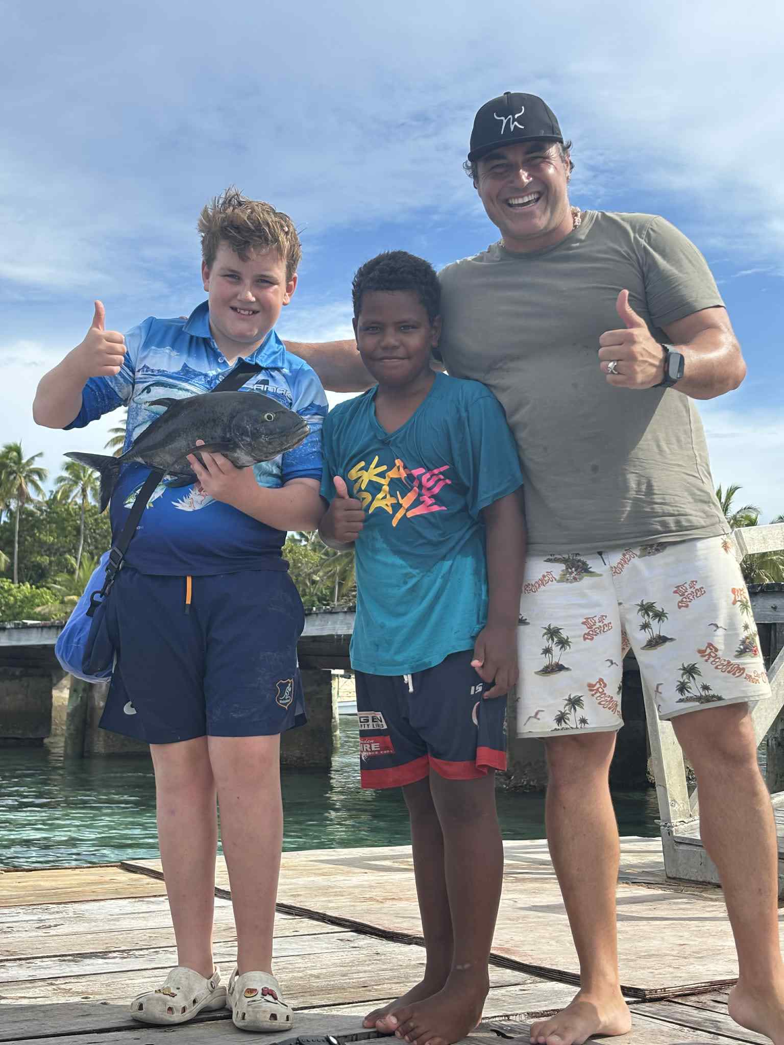 Joe's family with the day's catch on Mana Island, Fiji